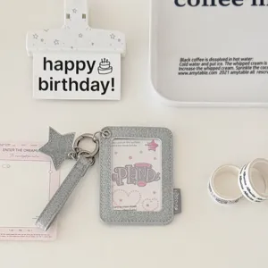 Glitter star PU photocard holder detail showing sparkling texture and metal ring pendant.