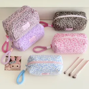 Cute plush leopard print pencil case and cosmetic storage bag with portable strap for travel.