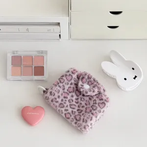 Details of fluffy pink leopard print coin purse with snap closure for daily portable use.