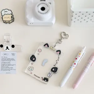 Clear acrylic cat photocard holder cute ins transparent card sleeve with heart keychain detail.