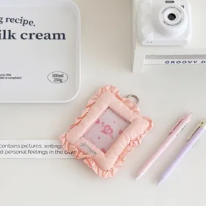 Pink quilted fabric photocard holder with ruffled lace trim, cute 3-inch ID card sleeve.