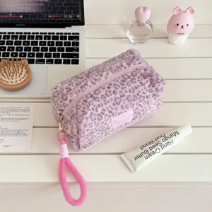 Plush leopard print cosmetic pouch detail, soft furry texture with convenient zipper closure.