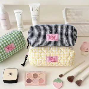 Detailed view of quilted grid pencil pouch with heart pattern, cute aesthetic storage bag.
