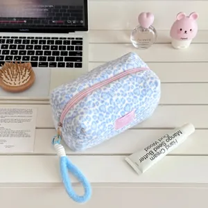 Plush leopard print makeup bag, cute fluffy travel toiletry pouch with zipper and wrist strap.