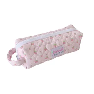 Pink quilted pencil case with cute strawberry print, soft aesthetic stationery pouch for school.