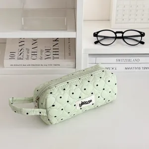 Green quilted pencil pouch with heart pattern and black dots, portable stationery bag.