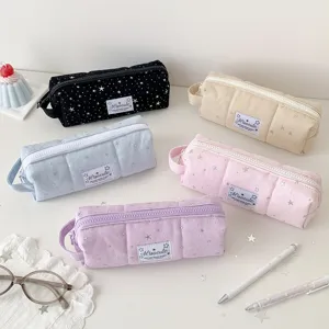 Detailed view of aesthetic canvas pencil case with star pattern, zipper, and cute label.