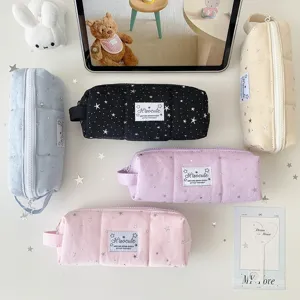 Detailed view of large capacity canvas pencil case featuring cute star pattern, portable storage.