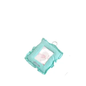 Cute mint green fabric photocard holder with delicate ruffles, perfect for 3-inch cards.