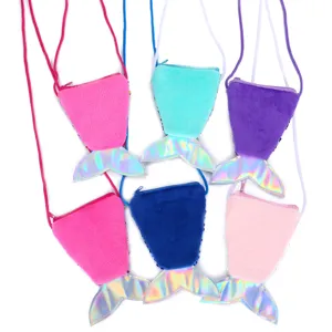 Detail view of cute plush mermaid tail crossbody coin purses featuring sparkling sequin details.