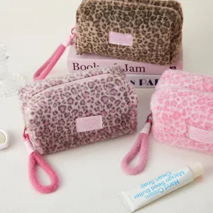 Plush leopard print cosmetic bag and pencil case detail, cute fuzzy travel pouch for daily use.