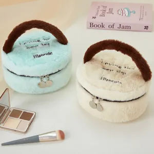 Cute plush cosmetic bag portable round storage pouch for makeup, lipstick, and daily travel essentials.
