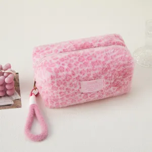 Cute pink plush leopard print cosmetic bag, soft fuzzy makeup pouch with wrist strap.