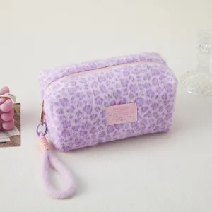 Purple leopard plush pencil case makeup bag with wrist strap and cute pink label detail.