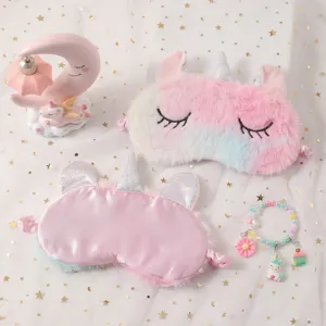 Plush unicorn eye mask detail shot, soft tie-dye plush with embroidery and silky back.