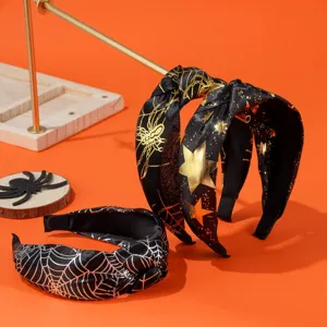 Halloween wide-brim knotted headbands with gold and silver spider web print patterns