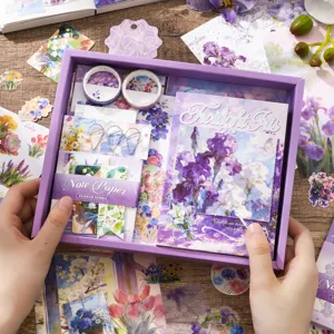 Purple stationery gift box set with journal, stickers, washi tape, and memo notes for daily crafting.