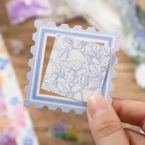 Blue stamp shaped journal stickers with leaf pattern, ideal for DIY scrapbooking and planners.