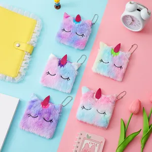 Plush unicorn coin purse with cute embroidery design, fluffy material and handy hanging chain.