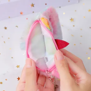 Close-up detail of fluffy unicorn coin purse interior lining and pink zipper design.