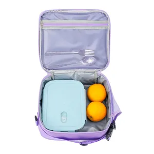 Detailed internal view of a purple thermal lunch bag containing a bento box and fruit.