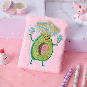 Cute pink plush notebook with sparkly sequin avocado design, perfect for daily journaling.