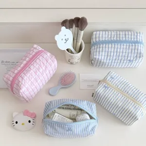 Cute aesthetic cosmetic storage bag and pencil pouch with sweet stripe grid and bow embroidery.