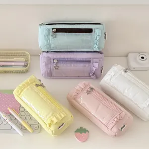 Detailed view of pastel ruffles pencil case, canvas storage pouch with clear window and star zipper.