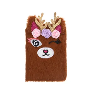 Cute brown plush notebook detail with golden antlers, floral crown, and sweet embroidered face.