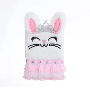 Fluffy bunny plush notebook detail, white cute journal cover with crown and lace skirt.