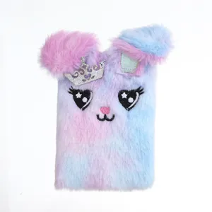 Fluffy plush bunny notebook with crown detail, cute cartoon design mini journal for notes.
