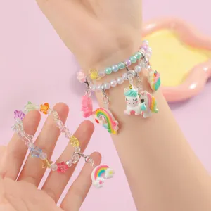 Cute cartoon unicorn DIY bracelet detail shot featuring colorful beads and resin charms.