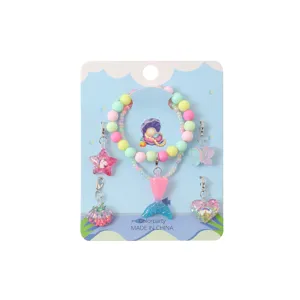 Children DIY charm bracelet set detail showing colorful beaded bracelets and cute cartoon pendants.