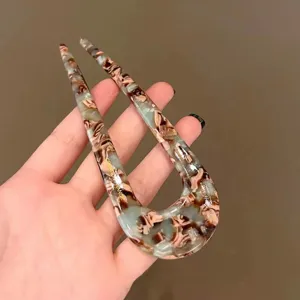 Elegant U-shaped hair stick for women, stylish tortoise shell pattern bun maker hair fork accessory.