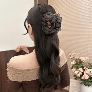 Elegant mesh flower hair claw clip with star rhinestones, secure grip for stylish ponytails and buns.