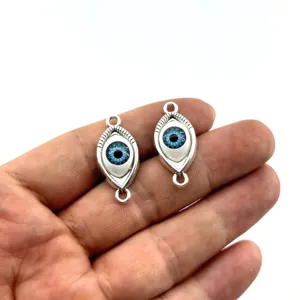 Vintage alloy evil eye double hole DIY jewelry charms for handmade bracelets and necklaces.