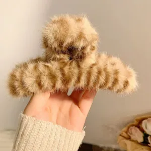 Large brown leopard plush hair claw clip for thick hair, stylish winter shark clip main view.