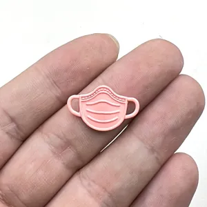 Charming pink mask metal pendant detail, perfect for DIY jewelry making, earrings, and cute crafts.