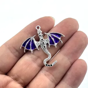 Detail view of the retro zinc alloy flying dragon pendant with purple enamel for DIY jewelry.