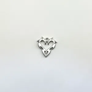 Detailed view of vintage silver hollow heart pendant accessory, ideal for DIY jewelry making.