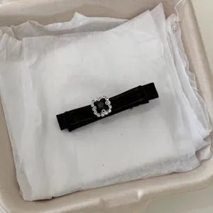 Black velvet hair clip with sparkling rhinestone square buckle, elegant bow barrette for women.