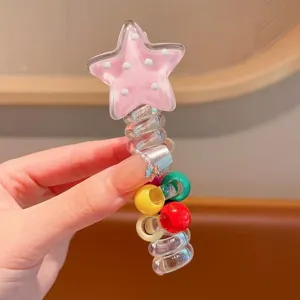 Detail shot of transparent spiral hair tie featuring pink star and colorful beads for daily wear.