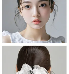 Detailopname van witte organza haarrekker met zwarte strik, ballet stijl haaraccessoire detail.