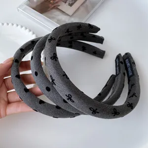 Korean style dark grey padded headband with cute black bow and polka dot patterns for women.