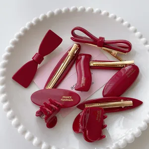 Red hair clip set with elegant bow and claw clips, retro sweet hair accessories for women.