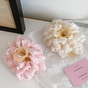 Large fluffy fabric hair claw, soft bow design, elegant style, perfect for thick hair volume.