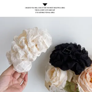 Large fluffy mesh hair claw detail showing exquisite fabric texture and elegant fairy style design.