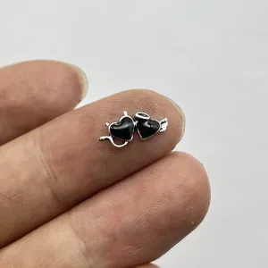 Detailed close-up view of a black enamel devil heart nail art charm, perfect for DIY crafts.