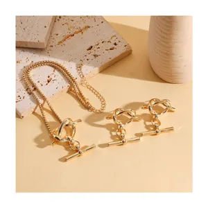 Goldfarbenes Metall Knoten Anhänger Halskette und Ohrringe Set, elegante Modeschmuck Accessoire.