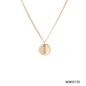Detailed close-up shot of the rose gold double chain necklace with letter I pendant.